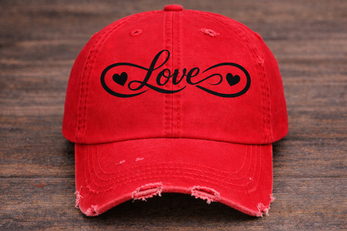 Embroidered Distressed hat s
Red cap with black “Love” infinity design